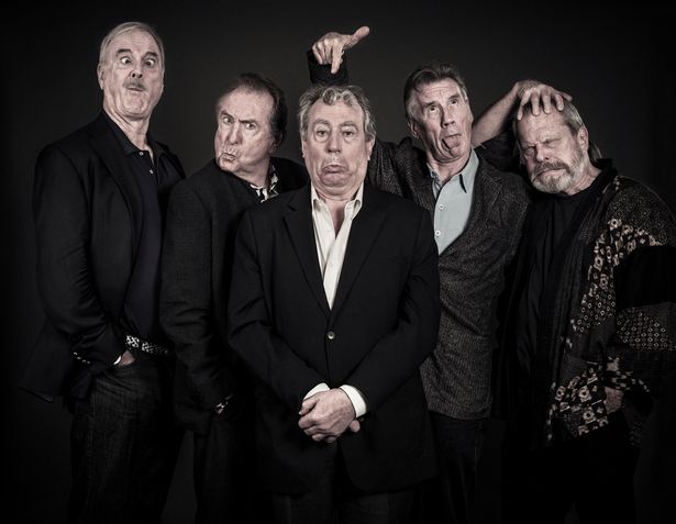 John Cleese poses with fellow Pythons Eric Idle, Terry Jones, Michael Palin, and Terry Gilliam.