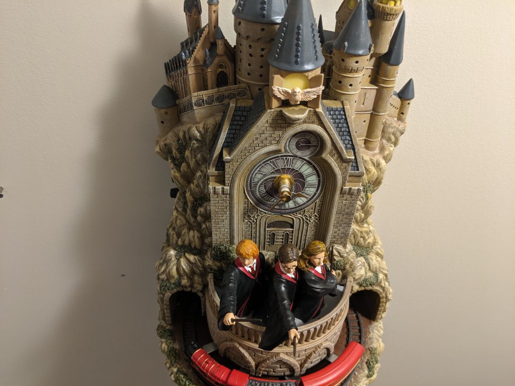 The Hogwarts wall clock features Harry, Ron, Hermione, and the Hogwarts Express