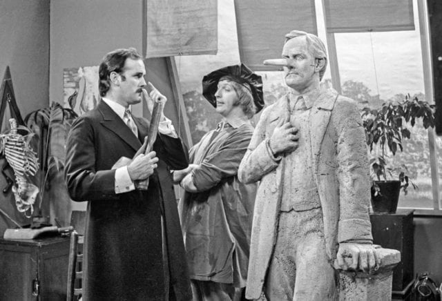 John Cleese, left. is pictured in a still from a "Monty Python's Flying Circus" sketch.