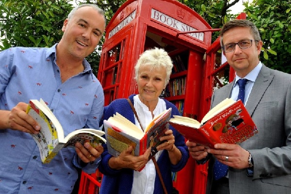 Dame Julie Walters poses during the opening of a children's book-swap library in England.
