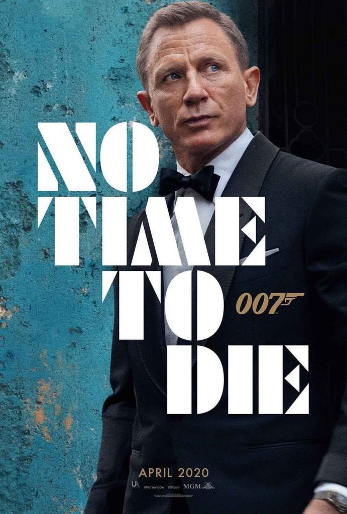 Pictured is a movie poster for "No Time to Die", starring Ralph Fiennes.