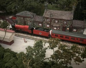 A miniature version of Hogsmeade Station with the Hogwarts Express.