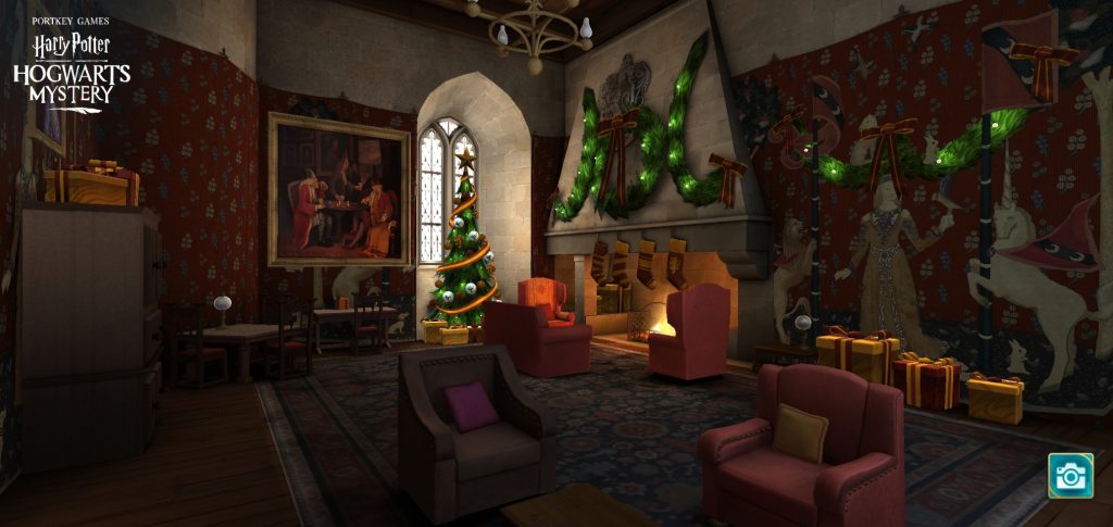 The Gryffindor Common Room is decorated for Christmas in "Harry Potter: Hogwarts Mystery".