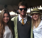Nick, in Hogwarts robes and sunglasses, between two friends