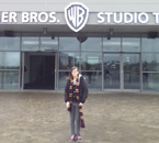 Deanna, wearing a Gryffindor scarf, stands in front of Warner Bros. Studio