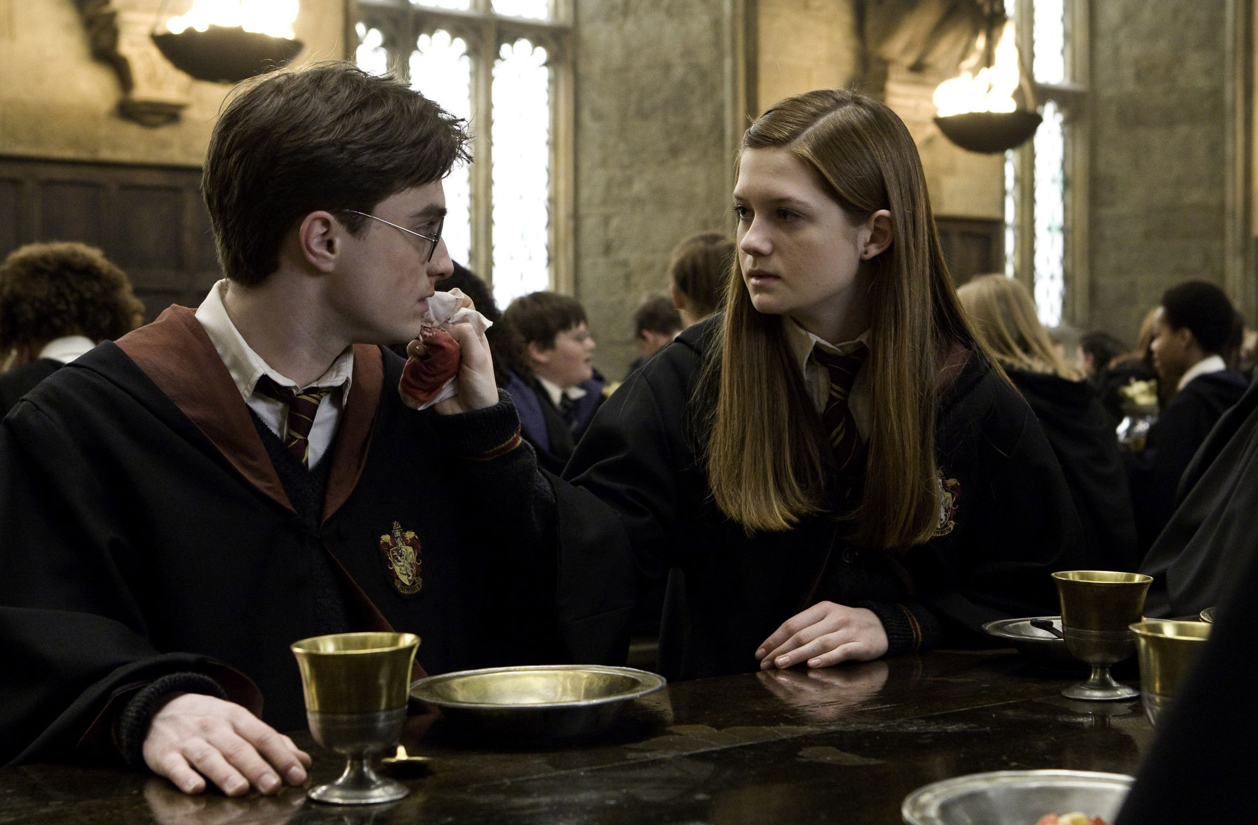 Ginny tending to Harry