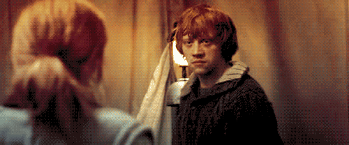 gif of Ron looking back at Harry and Hermione in disgust before ducking out of the tent to leave