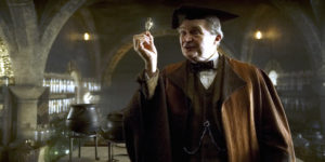 Horace Slughorn holding Felix Felicis