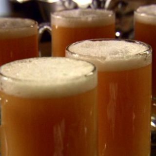 Five glasses of homemade Butterbeer.