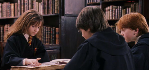 Harry, Ron, and Hermione reading in the library