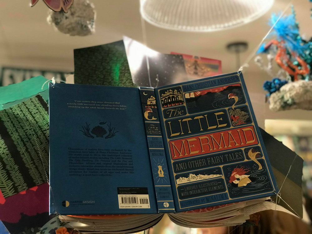 Copies of “The Little Mermaid and Other Fairy Tales” hung from the ceiling at the book launch.