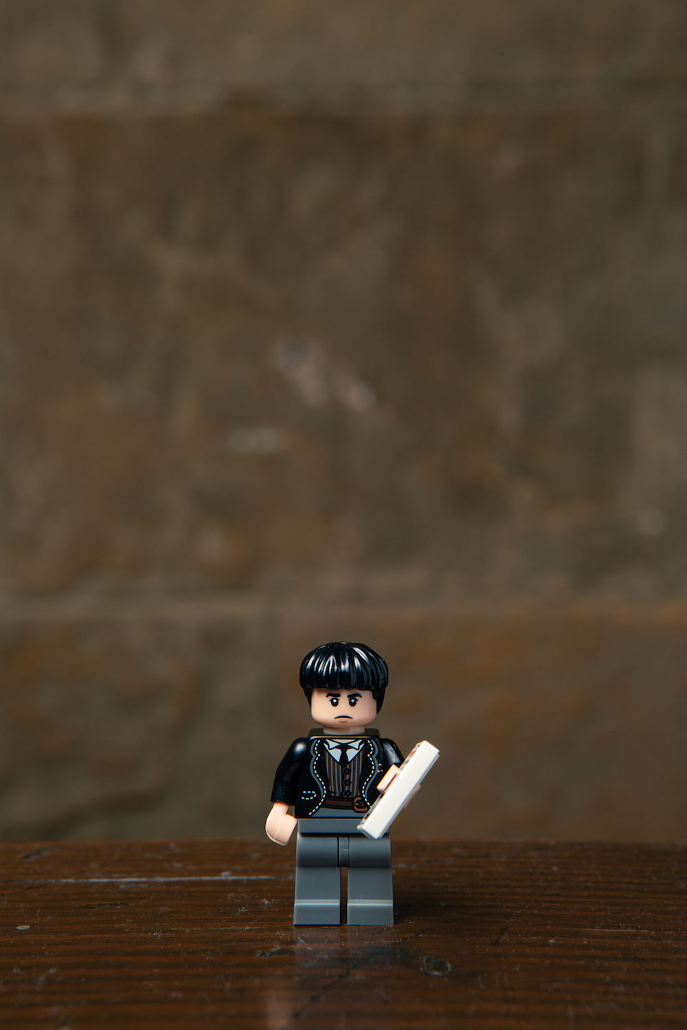 Credence’s LEGO minifigure includes one of his stepmother’s flyers (ugh, the heartache).
