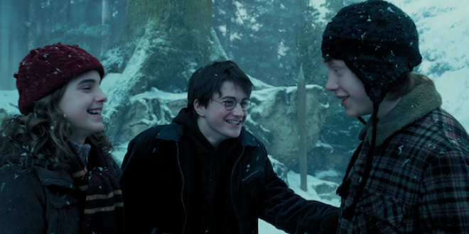 Harry Ron and Hermione laugh in the snow  outside the Shrieking Shack