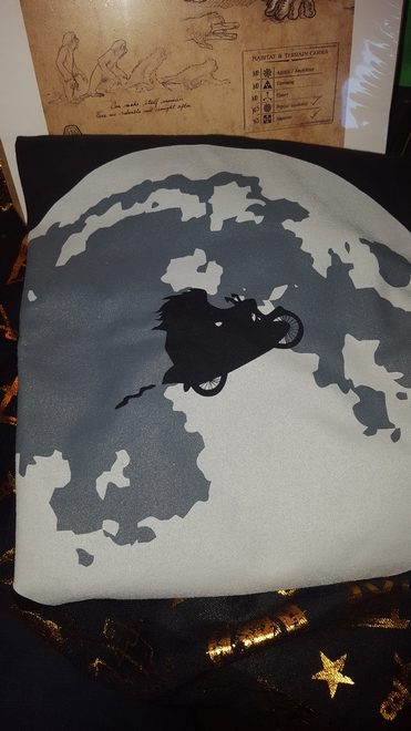 Geek Gear July 2018: T-shirt of Hagrid on Sirius’s motorbike flying through the night sky, a silhouette against the moon