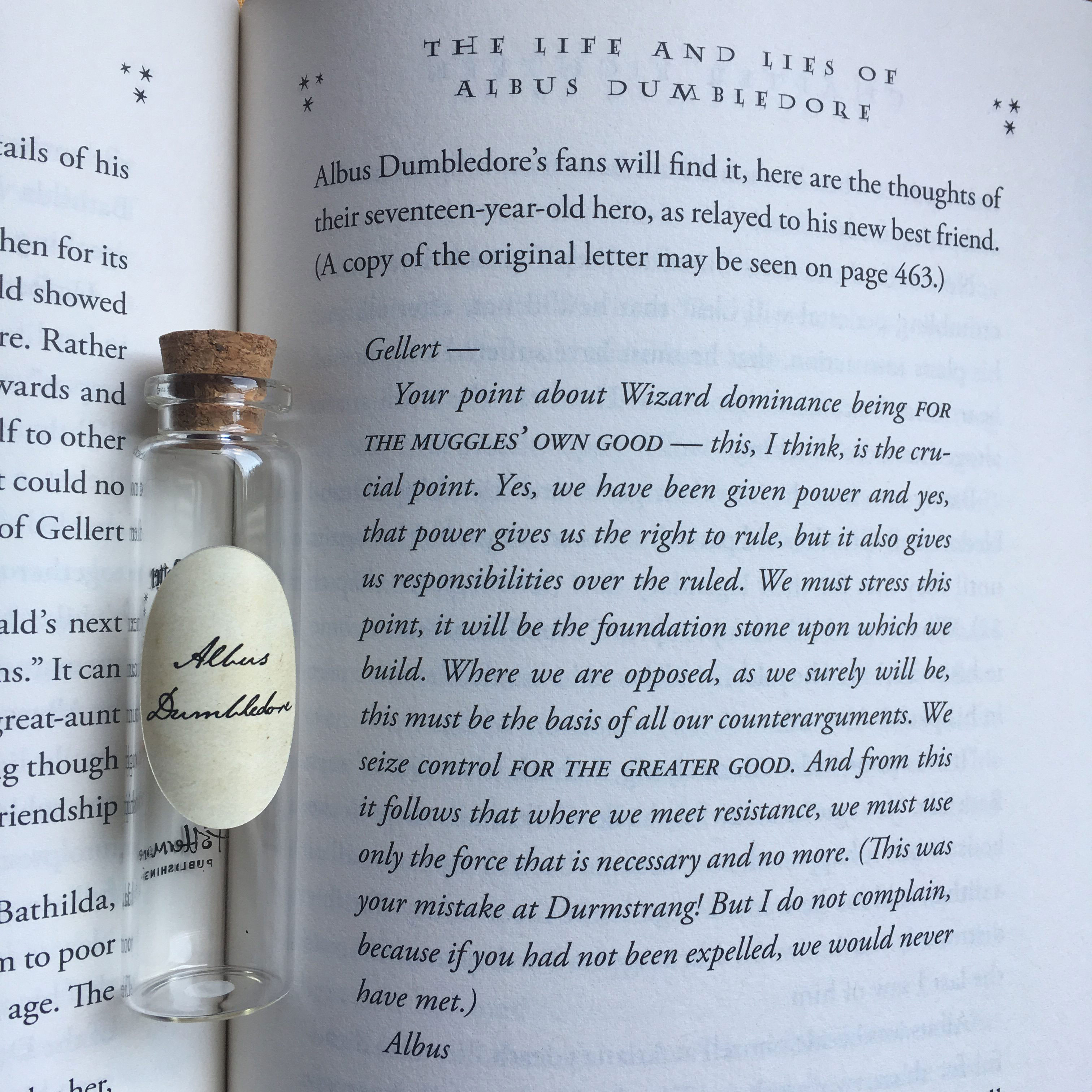Albus Dumbledore’s Pensieve vial lying on top of the page containing young Dumbledore’s letter to young Grellert Grindelwald showing their belief in the “greater good,” from Chapter 18, “The Life and Lies of Albus Dumbledore,” from “Harry Potter and the Deathly Hallows”