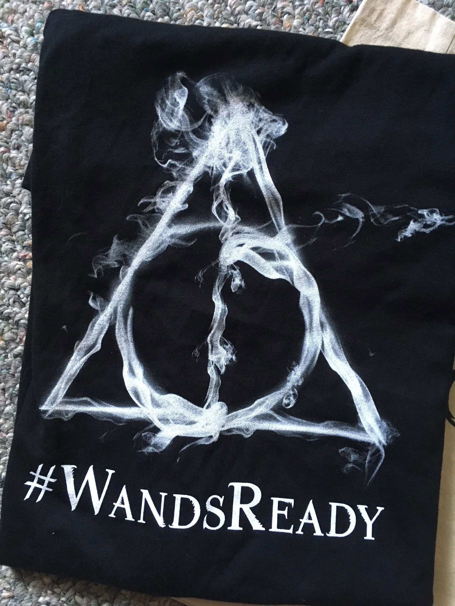“Fantastic Beasts: The Crimes of Grindelwald” back side of T-shirt showing Wizarding World logo