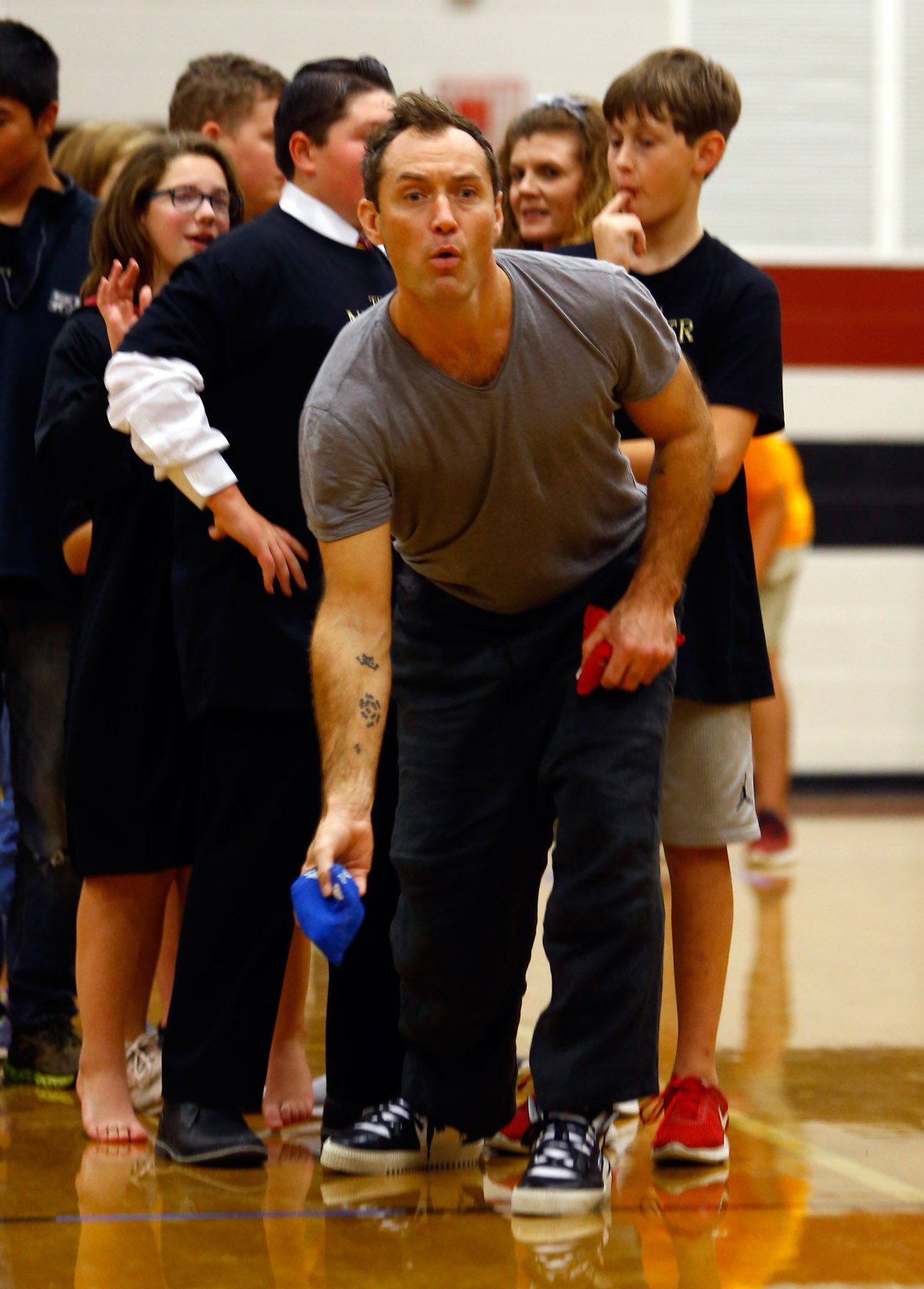 Jude Law from “Fantastic Beasts: The Crimes of Grindelwald” participates in a game to help celebrate Wizarding World Day at Parkside Middle School in Baileyton, AL.  (Photo by Butch Dill/Getty Images)