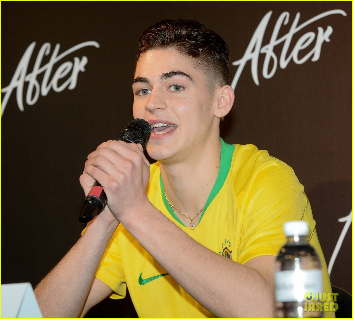 Hero Fiennes-Tiffin speaks to reporters during a press event for “After” in Brazil.