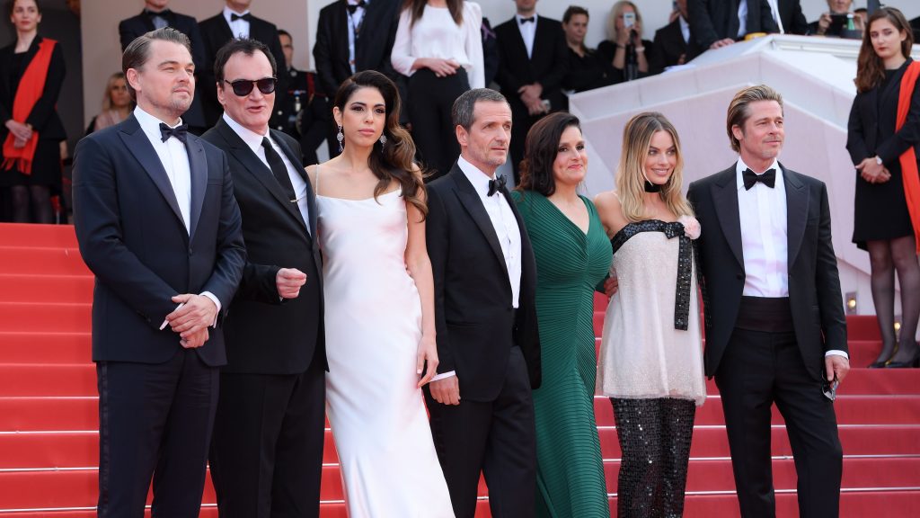 David Heyman pauses on the red carpet at Cannes with Leonardo DiCaprio, Quentin Tarantino, Daniela Pick, Shannon McIntosh, Margot Robbie, and Brad Pitt.