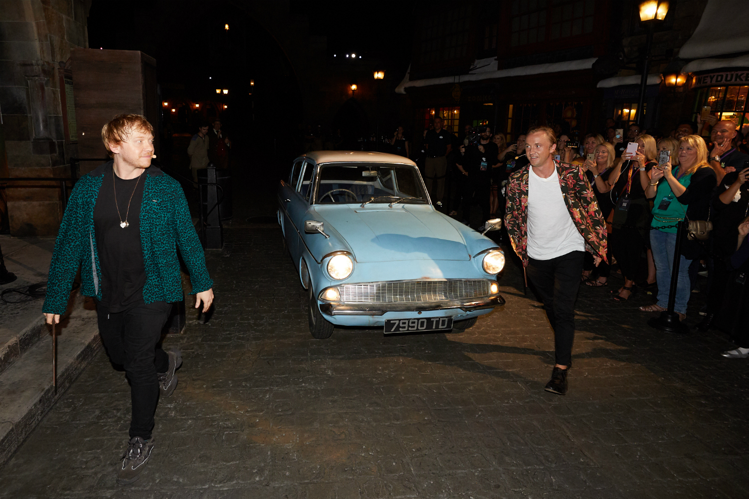 Rupert Grint and Tom Felton emerge from Arthur Weasley’s Ford Anglia to join fellow cast members onstage.