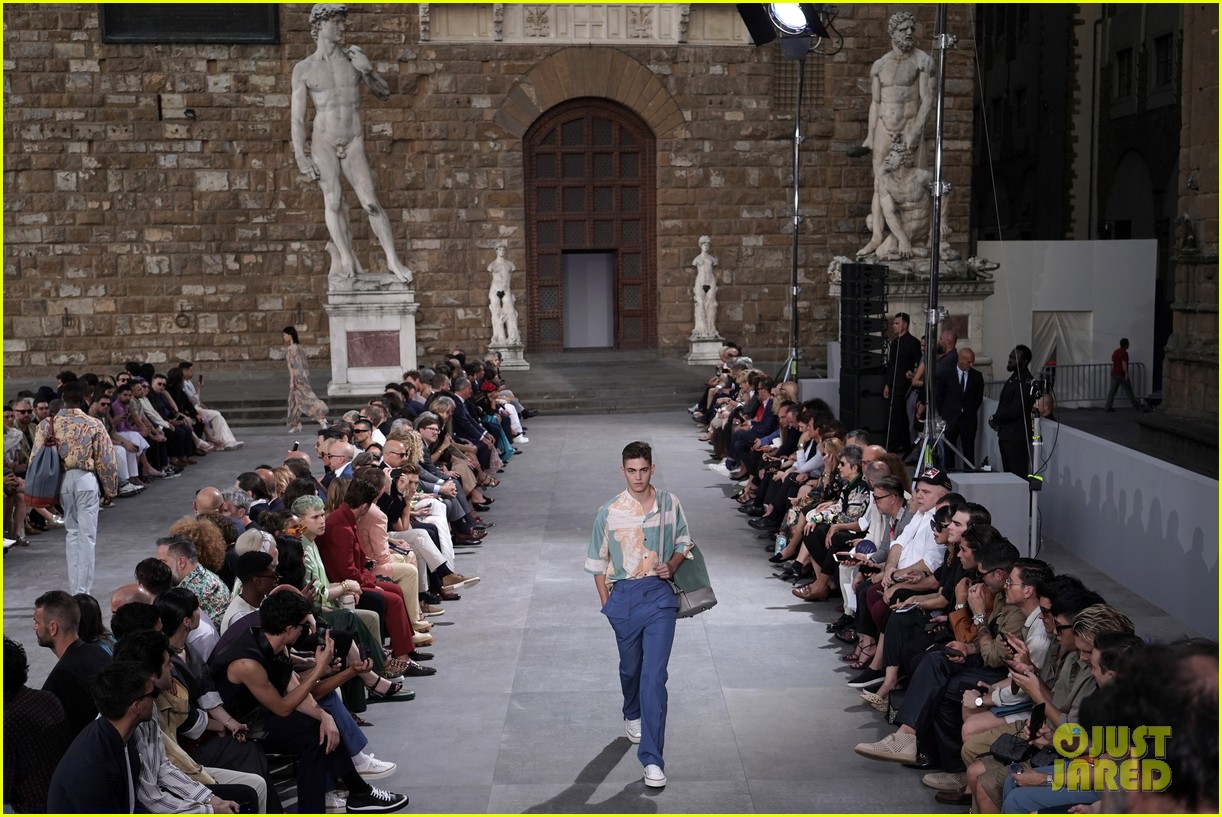 Hero Fiennes-Tiffin walks the runway at a Salvatore Ferragamo fashion show in Florence.