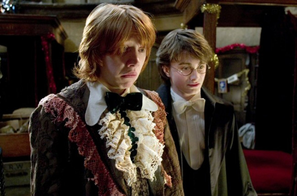 Ron and Harry in dress robes, looking at Ron's ugly ruffled robes