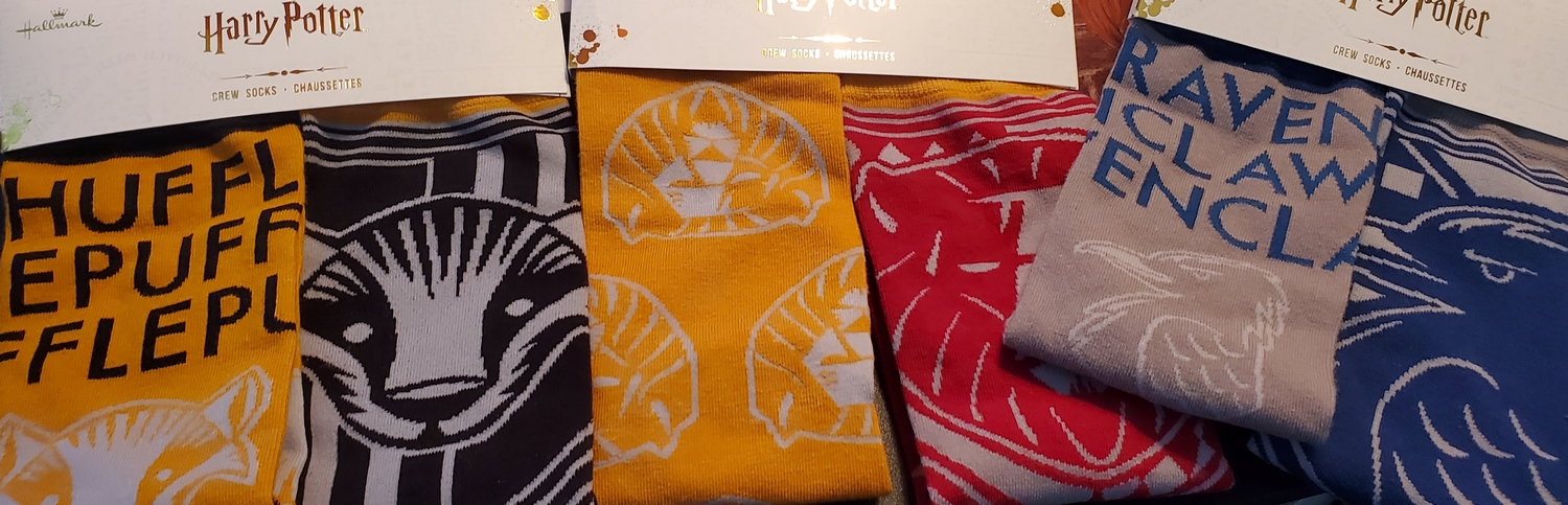 Harry Potter Crew Socks, featuring Hufflepuff, Gryffindor, and Ravenclaw Houses from Hallmark Gold Crown