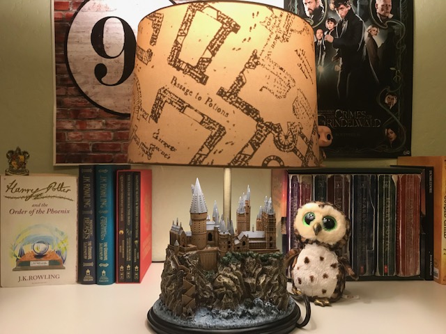 Harry Potter Hogwarts Lamp from The Bradford Exchange: pictured with other Harry Potter collectibles and books, Marauder’s Map lampshade illuminated