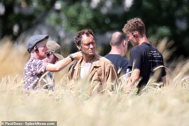 Does he look bedraggled enough? Crew make sure Jude Law is on point during filming for “The Third Day”.