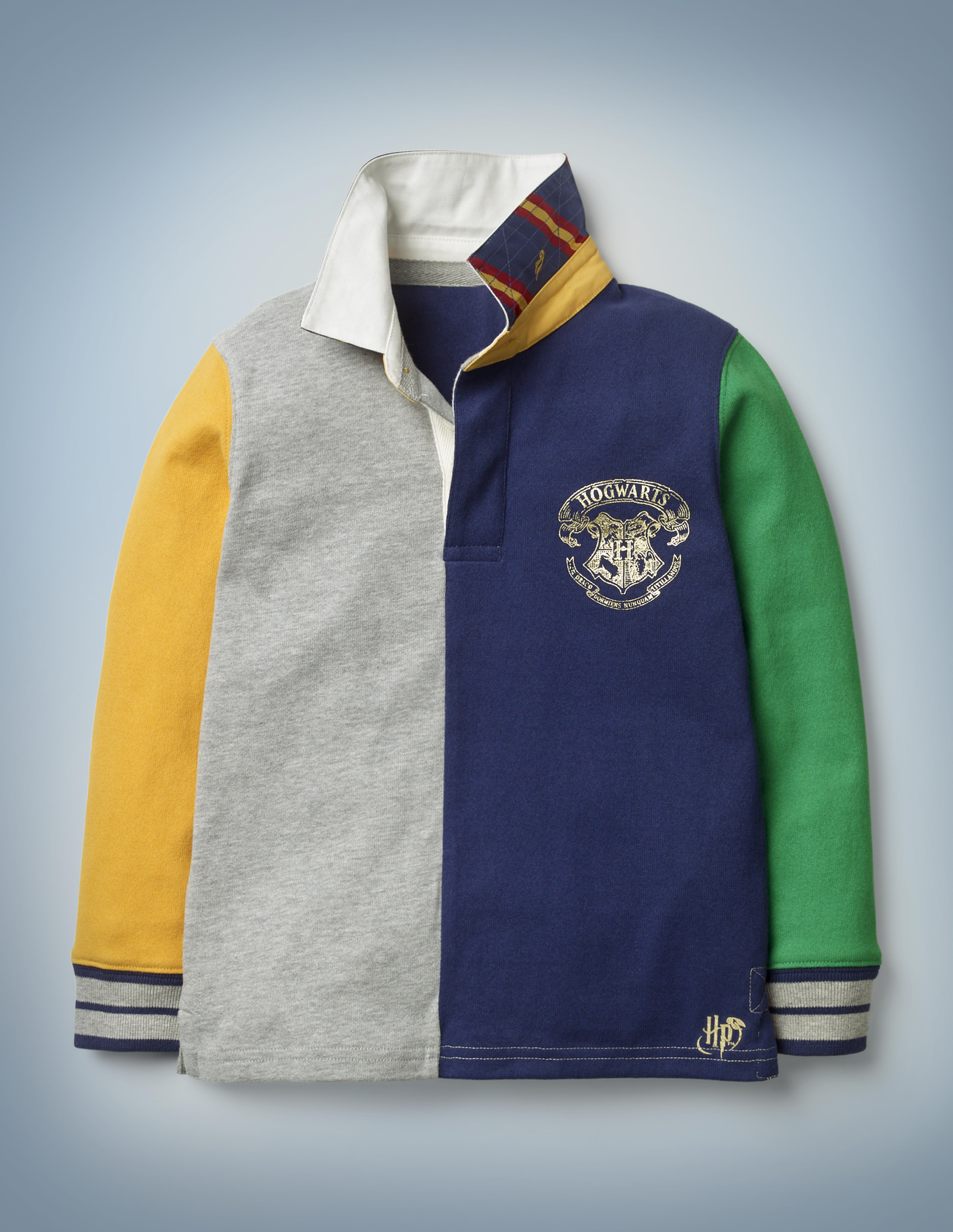 The Mini Boden Hogwarts Rugby Shirt, multi-color, has a fun patchwork feel. The shirt is collared with cuffs and features a Hogwarts crest in the front pocket area. It retails at £30.