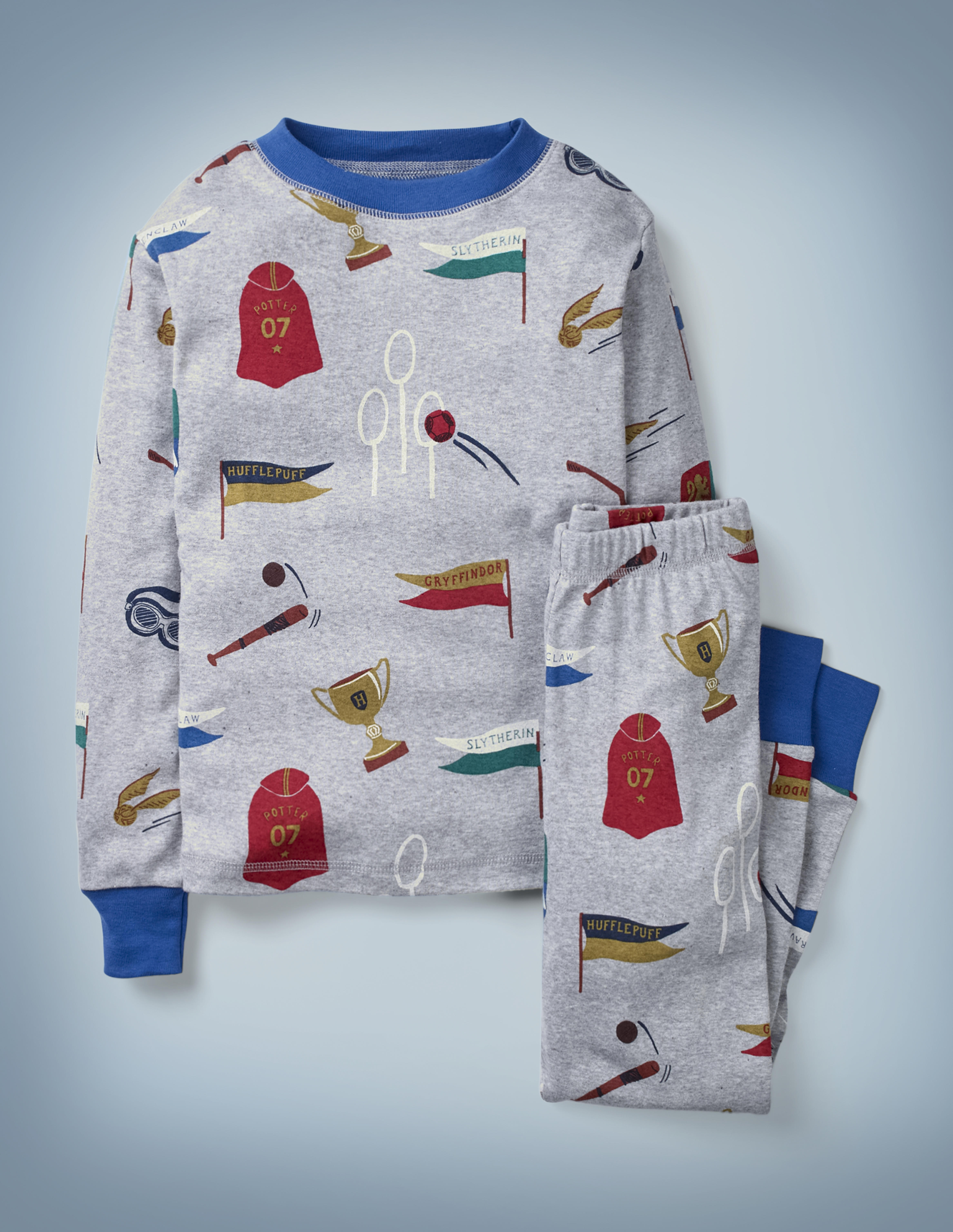 The Mini Boden Harry Potter Long John Pyjamas in gray feature all-over images of Quidditch-related items, including a Quaffle flying through the hoop, a Golden Snitch, a Quidditch Cup, and more. The top-and-bottom set retails at £24.