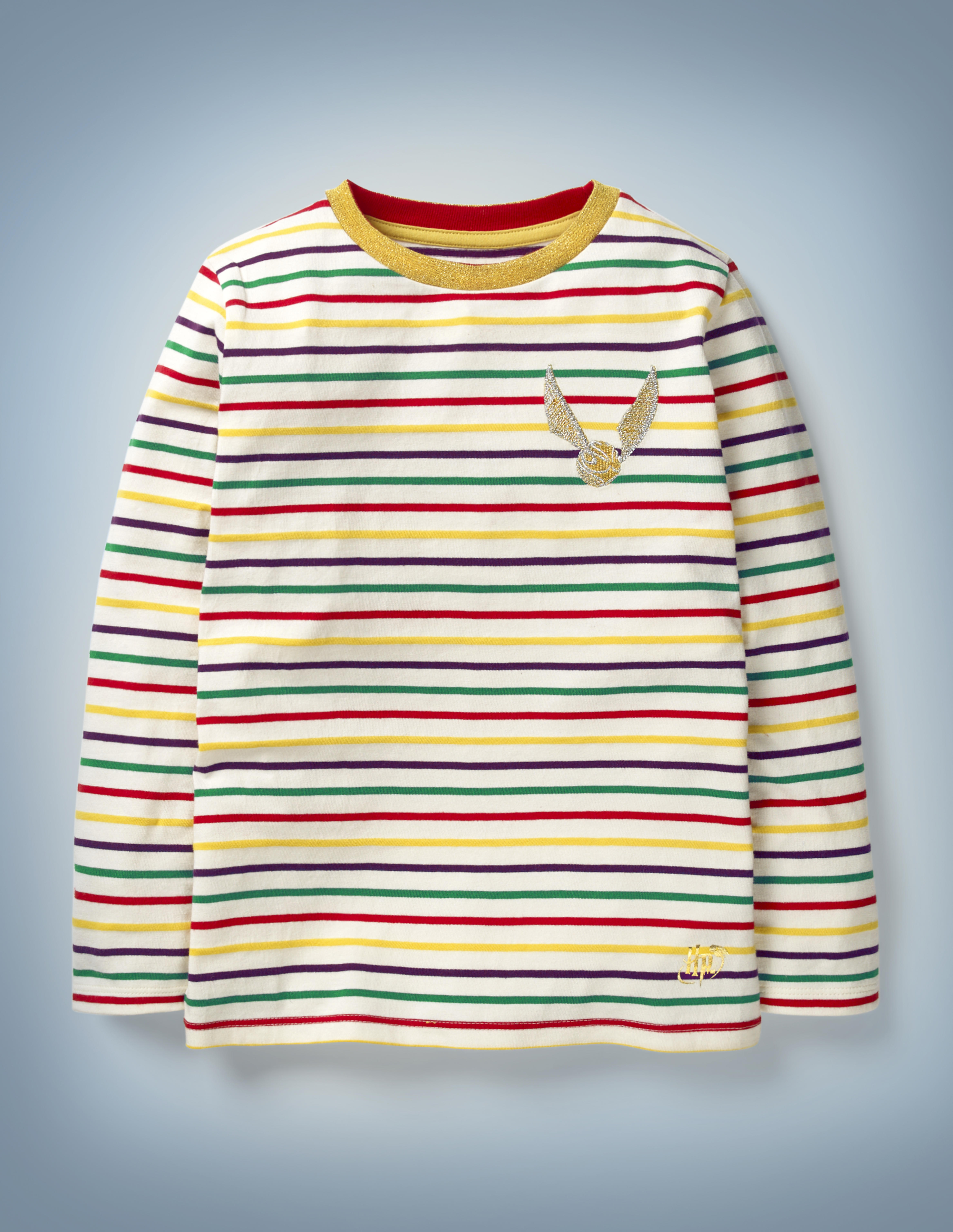 The Mini Boden Golden Snitch Breton, multi-color, features all-over stripes in Hogwarts House colors between white and an image of a Golden Snitch in the front pocket area. It retails at £20.