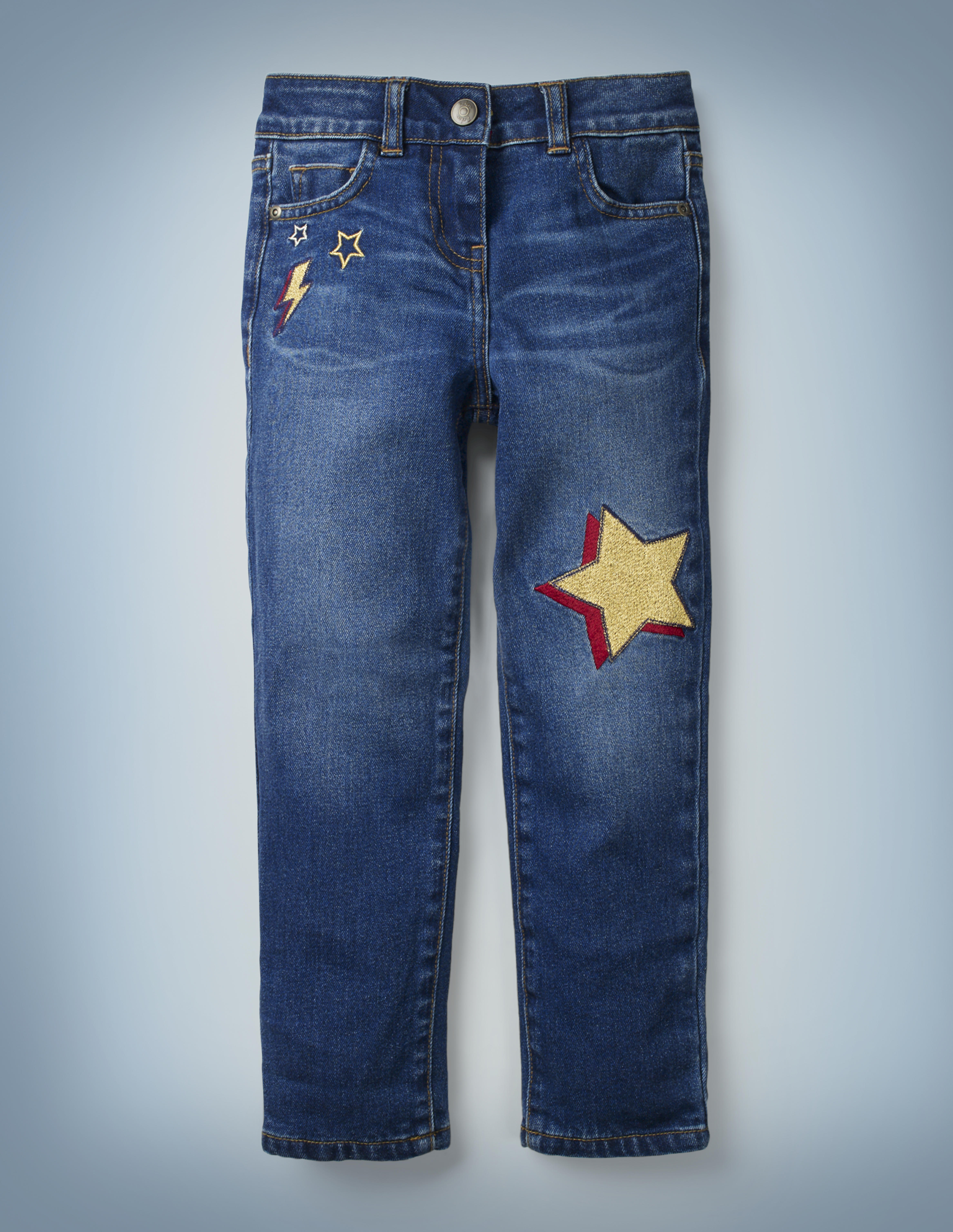 The Mini Boden Lightning Bolt Jeans include a fun design of stars and a red-and-gold lightning bolt near the right front pocket and a red-and-gold star in the left knee area. They retail for £28.