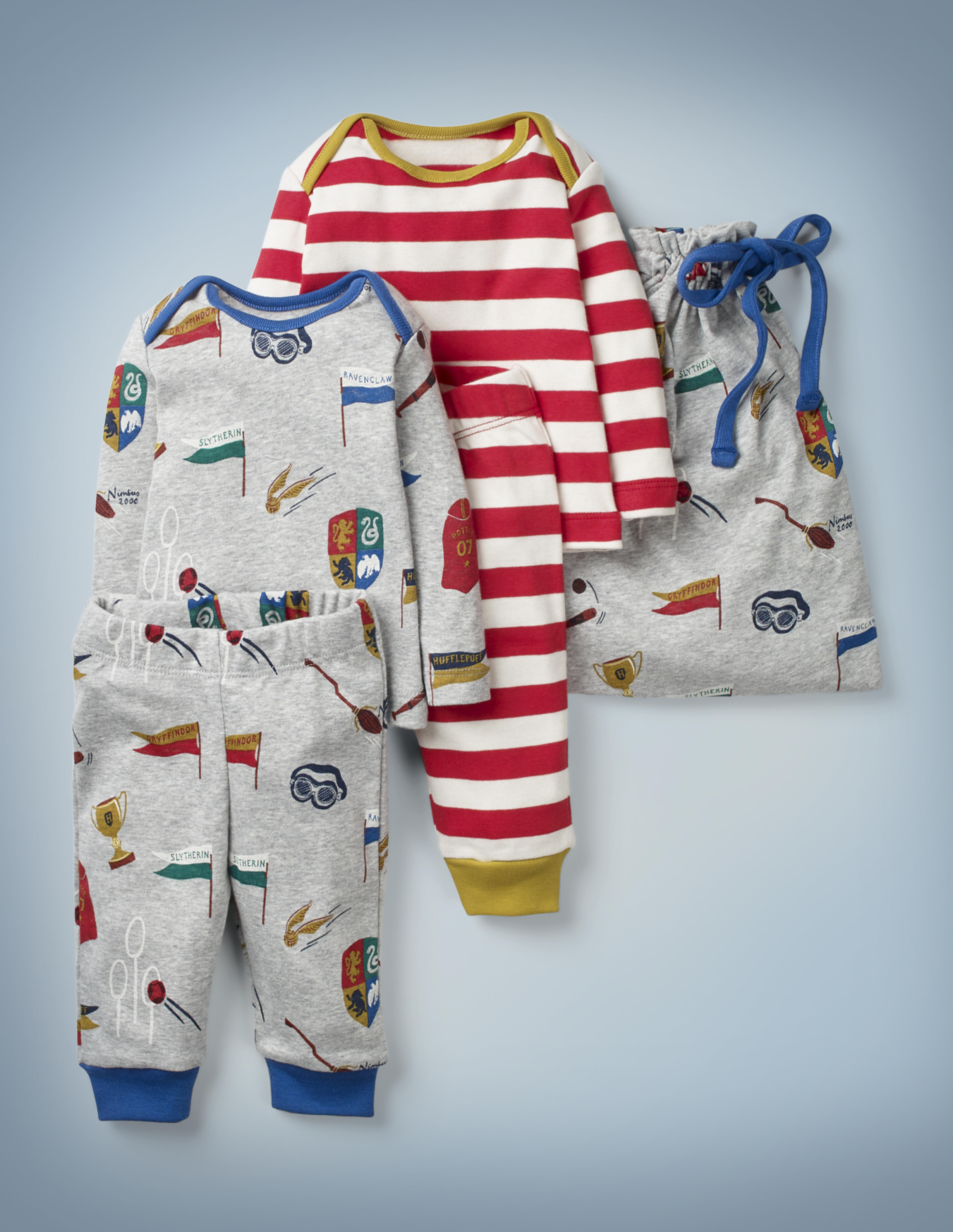The Mini Boden Harry Potter Play Set, multi, features two top-and-bottom play outfits – one gray and featuring all-over images of Quidditch-related items, one with all-over red-and-white stripes and gold collar and pant cuffs – and a gray drawstring bag featuring Quidditch items. It retails between £35 and £38.