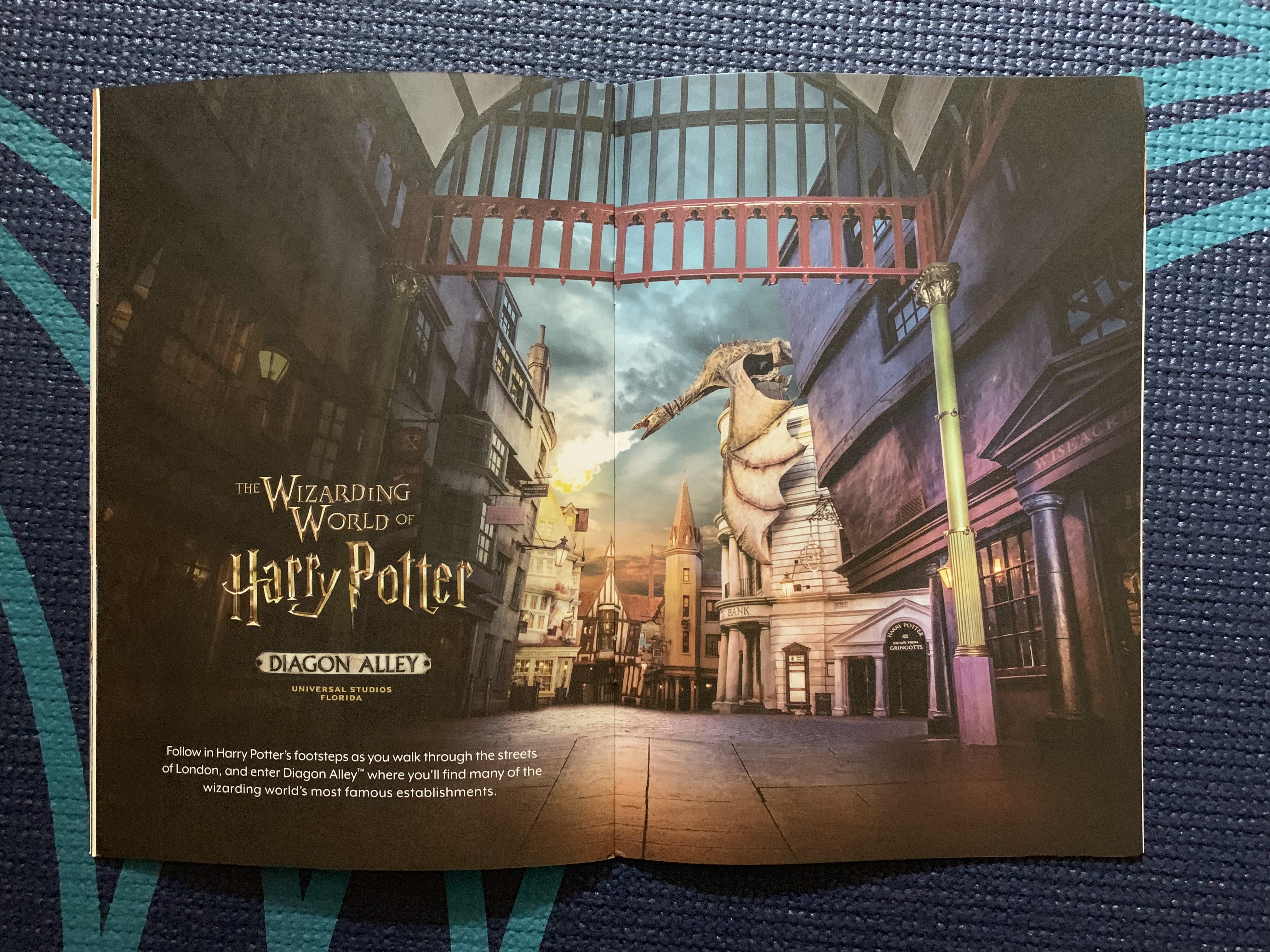 Your “Wizarding World of Harry Potter Exclusive Vacation Package” will include a special travel guide. Visible are pages describing Diagon Alley in Islands of Adventure.
