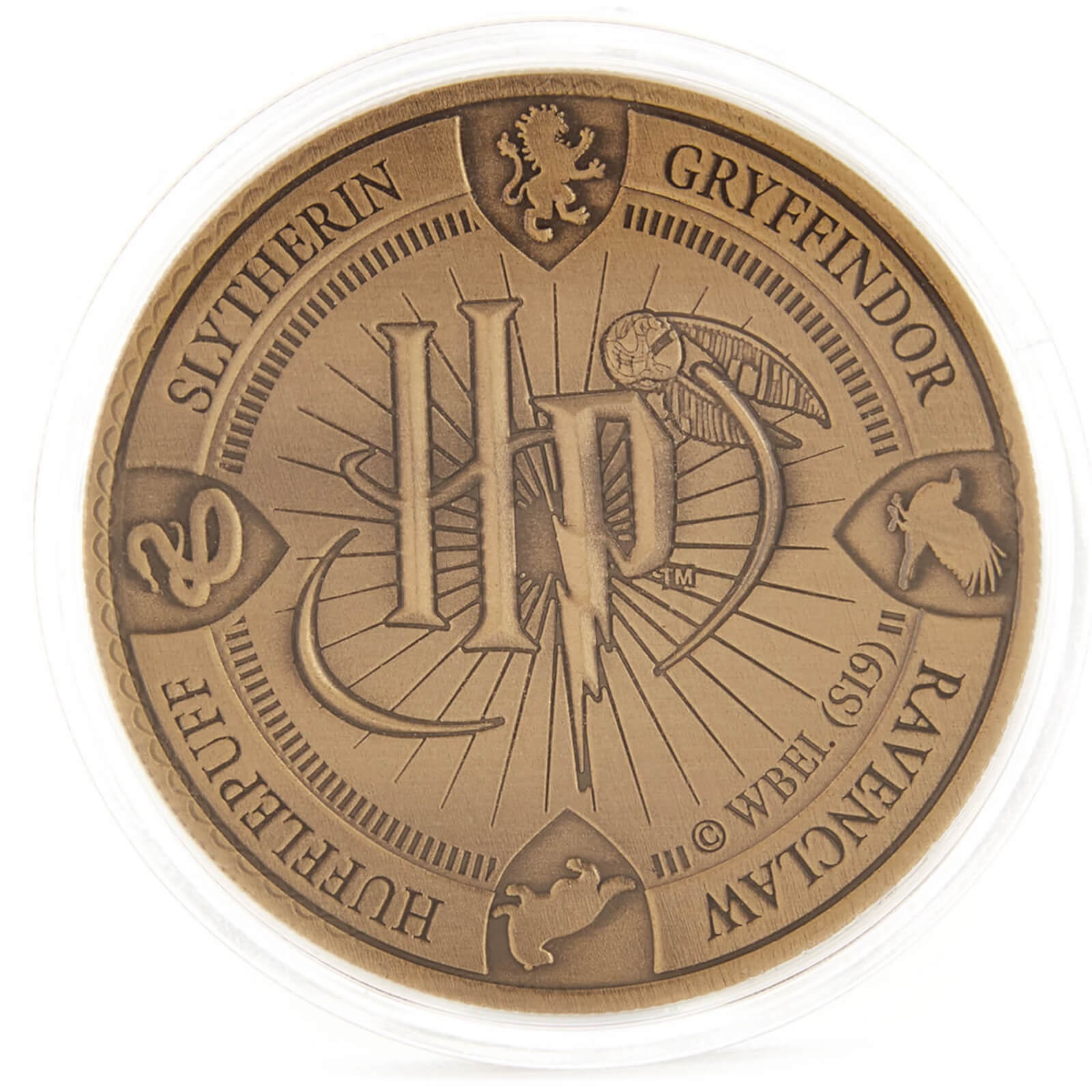 One side of a coin included in the “Harry Potter” coin Advent calendar displays an “HP” logo with a Golden Snitch and the names and crests of the four Hogwarts Houses around the edge.