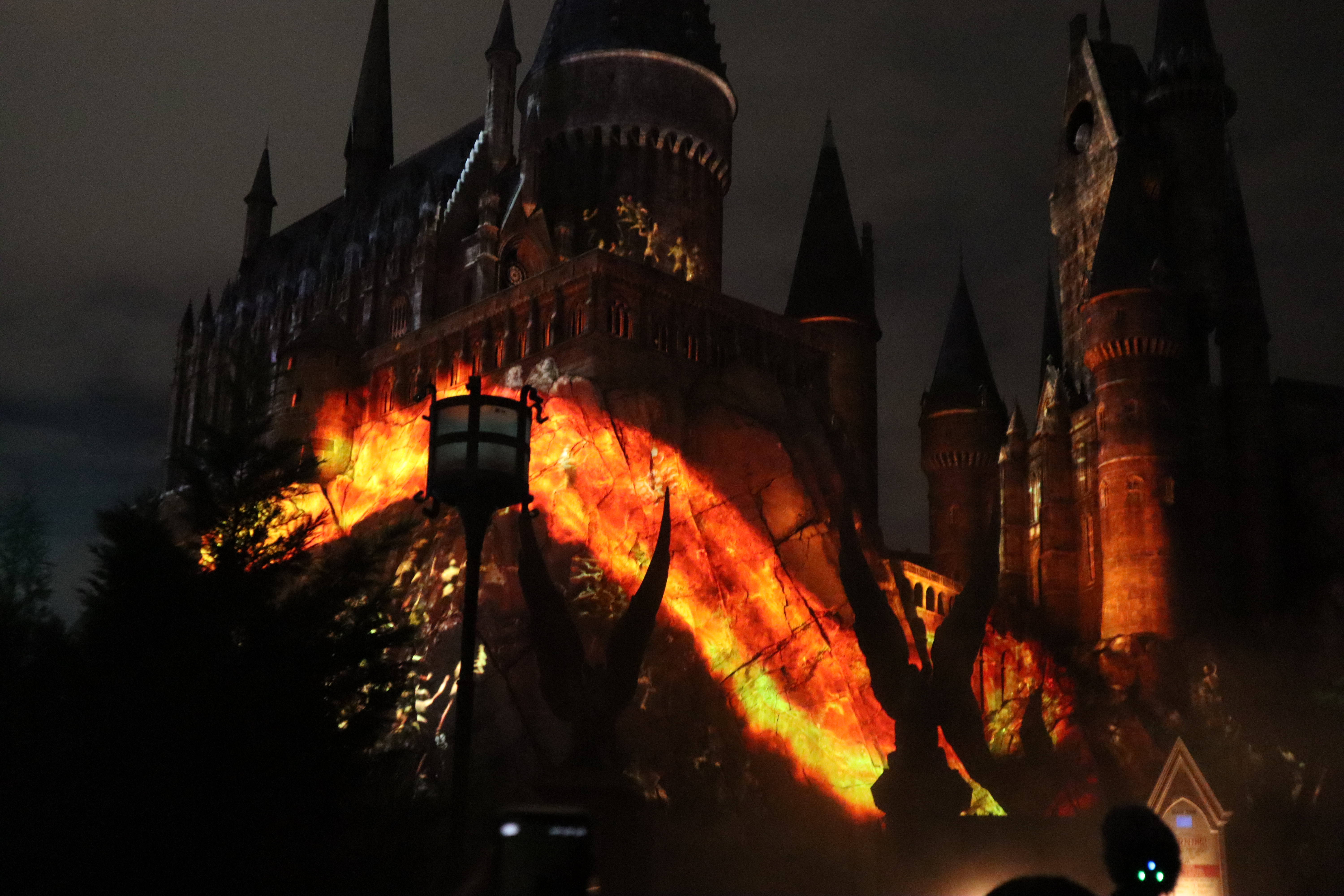 Inferi create a fiery wall up the sides of the castle in “Dark Arts at Hogwarts Castle.”
