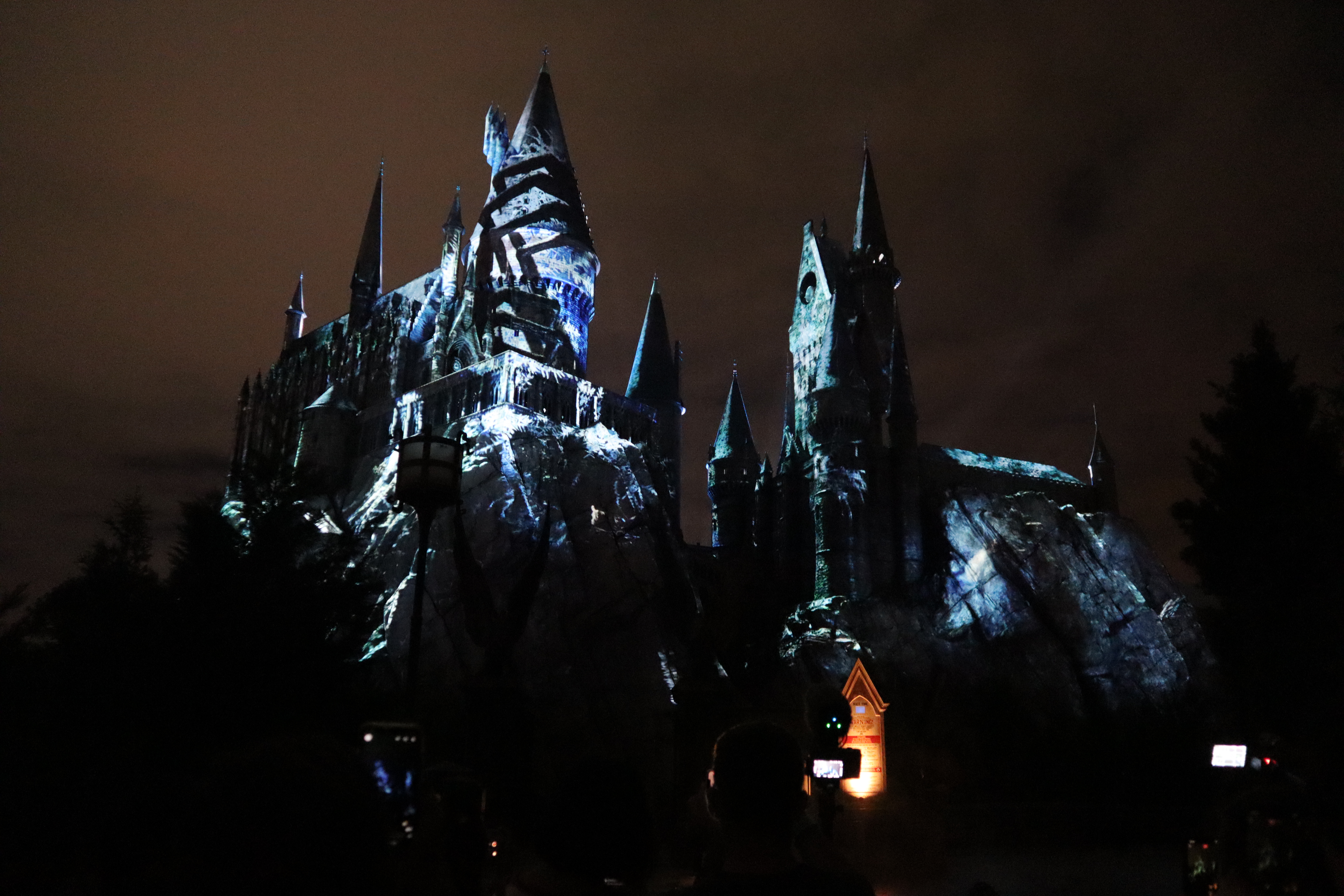 Dementors’ icy fingers grip the tower in the “Dark Arts at Hogwarts Castle” light show.