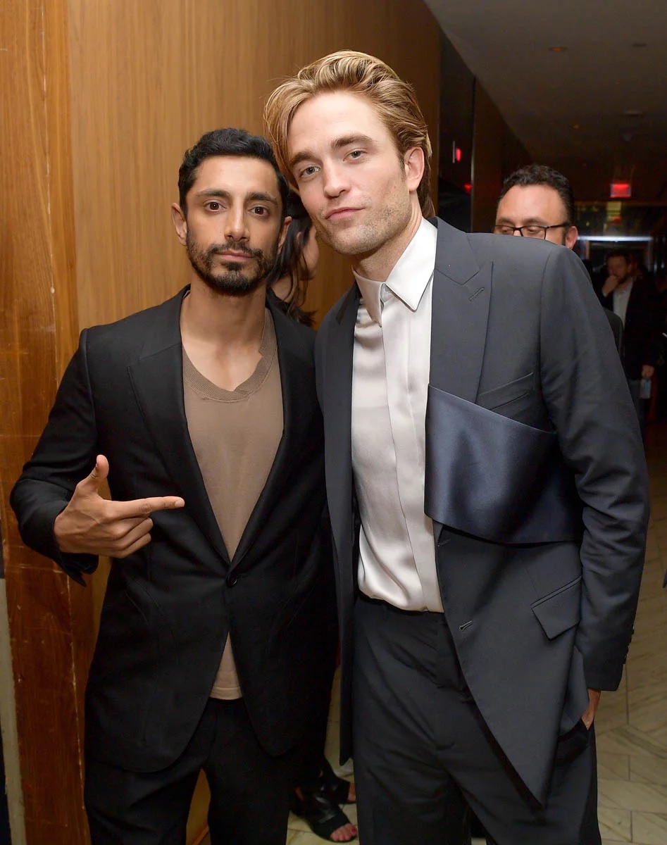 Robert Pattinson poses for a photo with Riz Ahmed at the Toronto International Film Festival.