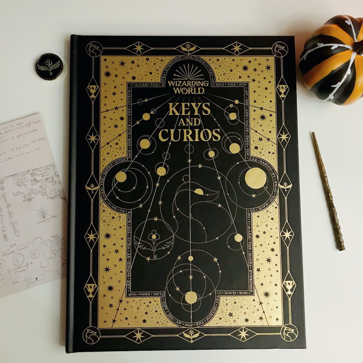 The Keys and Curios journal comes with a winged key magnetic pin and an original sketch by J.K. Rowling. You’ll have to supply your own wand and pumpkin!