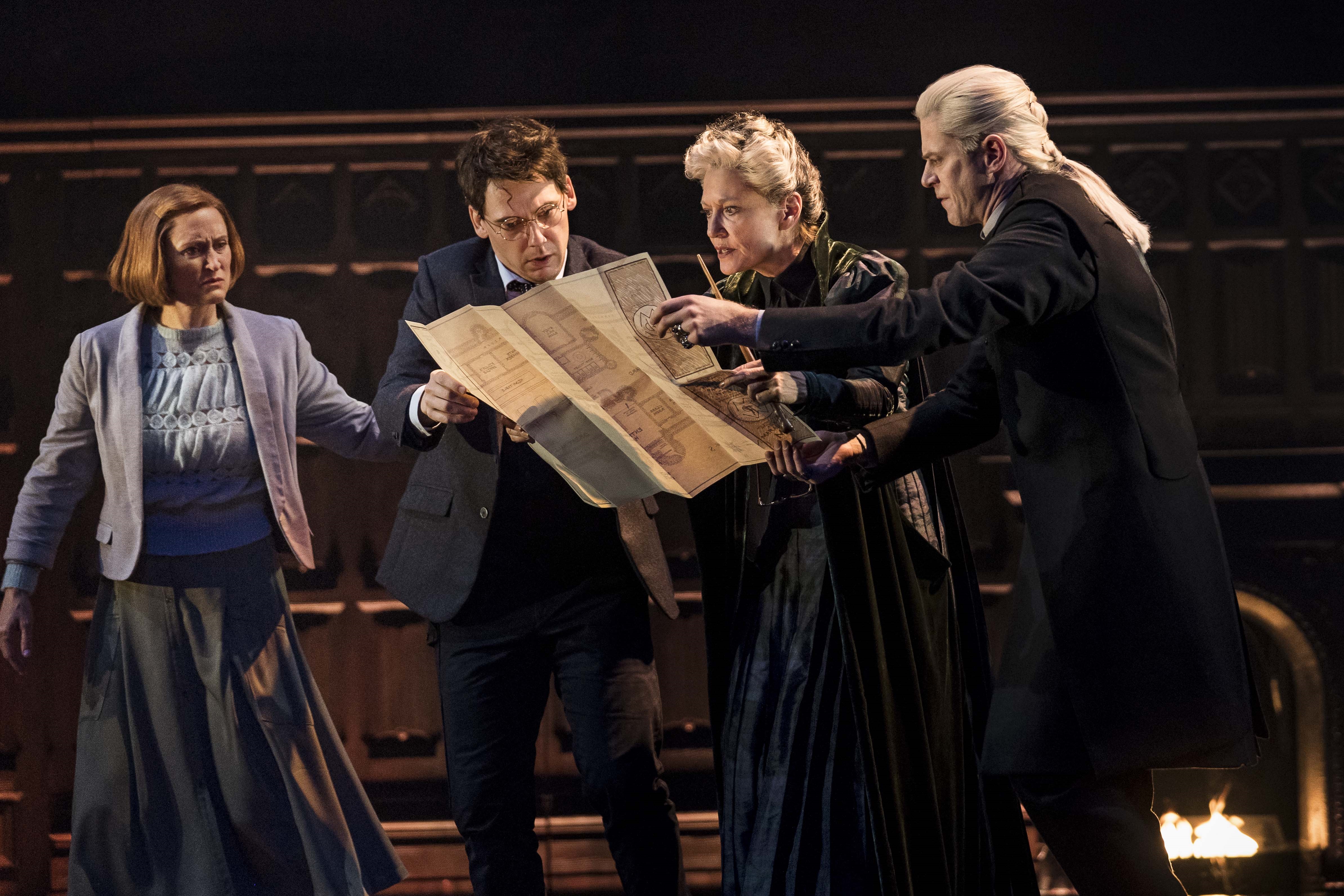 Ginny, Harry, Professor McGonagall and Draco examine the Marauder's Map in a scene from "Harry Potter and the Cursed Child" San Francisco.