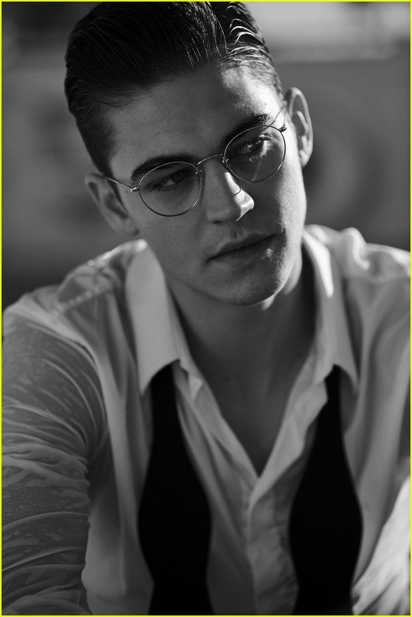 Hero Fiennes-Tiffin looking disheveled and studious in a campaign photo for Oliver Peoples.