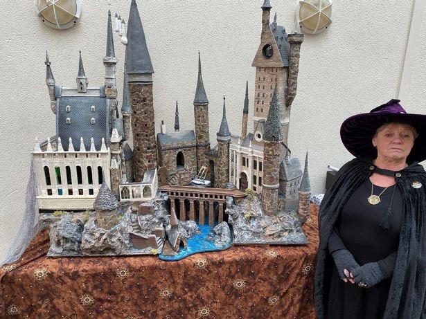 Clarke with her model of Hogwarts, which was constructed out of recycled materials.