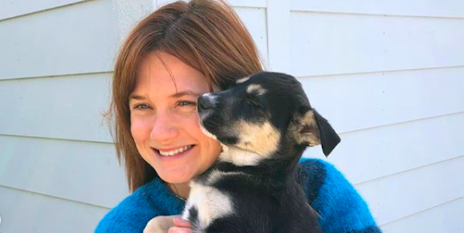 Bonnie Wright holding a dog