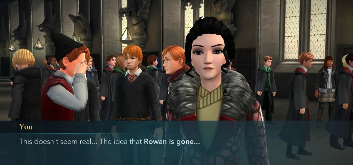 A few of the Weasleys mourn Rowan Khanna in "Harry Potter: Hogwarts Mystery".