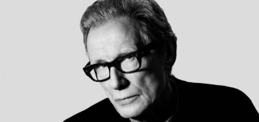 Bill Nighy poses for a portrait in black and white.