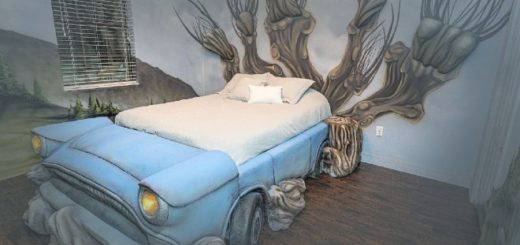 A custom bed in the shape of Arthur Weasley's pale blue Ford Anglia car is pictured in the middle of a bedroom. At the head of the bed, the Whomping Willow is painted on the wall very elaborately, with three dimensional elements protruding from the wall. The Hogwarts grounds are painted on the rest of the walls.