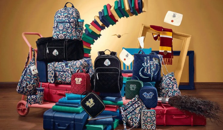 Various bags, handbags, lunchbags, wallets are pictured in Hogwarts themed designs among floating Harry Potter items such as books, acceptence letters, scarves, and the golden Snitch.