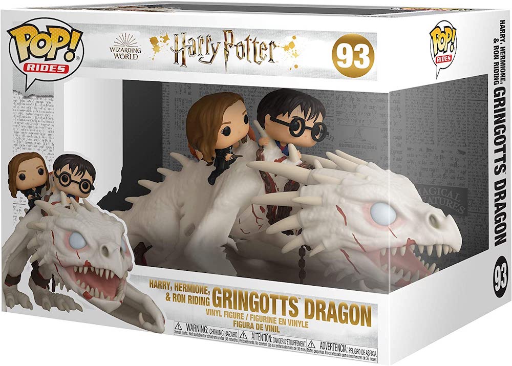 An image of the packaging for the Funko Pop! of Harry, Hermione, and Ron riding the Gringotts dragon.