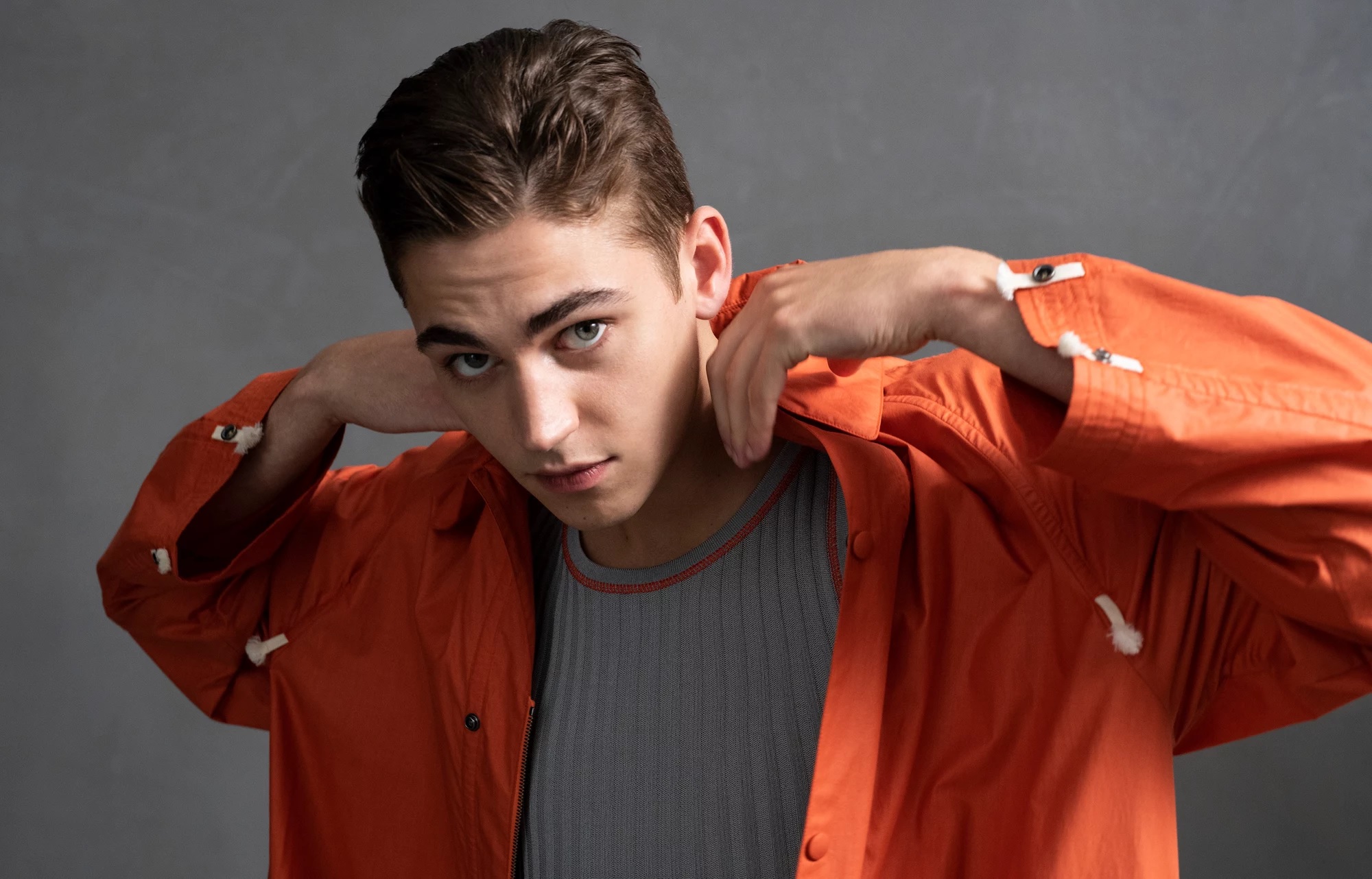 Hero Fiennes-Tiffin is popping his collar to give you a better sniff of his Ferragamo fragrance.